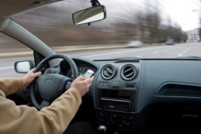 Person driving a car at high speed