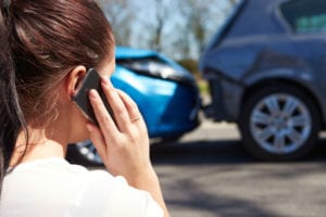 Woman calling car accident lawyer on what to do and not to do after a car accident