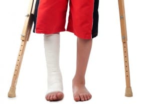 A victim of a New Jersey car accident with a cast on crutches