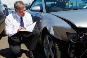Practical legal advice for New Jersey auto accident victims is offered by an attorney examining a car crash.