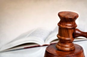 A gavel and law book used in a New Jersey metal hip relacement problems lawsuit