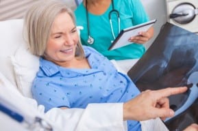 A New Jersey metal hip replacement lawsuit patient reviews xrays with attorneys and physicians
