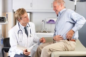 Doctor talks with New Jersey metal hip replacement side effects patient