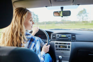Teenager driving a car
