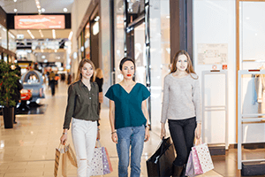 3 women walking in a new jersey mall