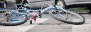 blue bicycle on the road after a bicycle accident