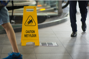 yellow sign to avoid slip and fall injuries in New York business