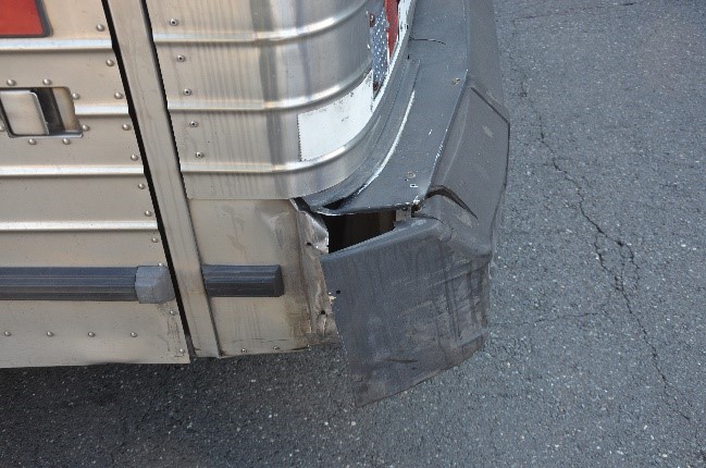 damage to the rear end of a bus from a motorcycle accident in New Jersey
