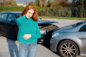 woman holding her injured neck after a car accident in woodcliff lake