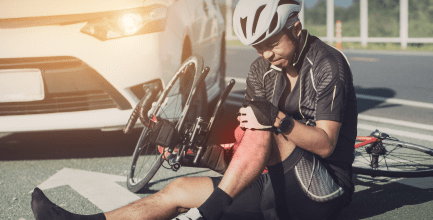 Bicycle Accident in New Jersey, man hit by car on his bicycle, holding an injured leg