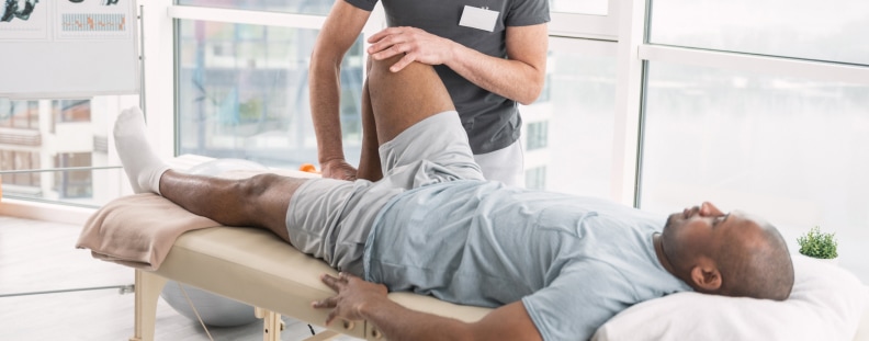 Image of a man undergoing physical therapy