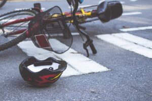 Bicycle and cicyling helmet on the road after an accident
