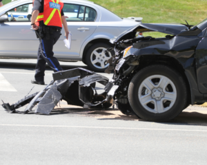 emergency workers clear the place after a car accident
