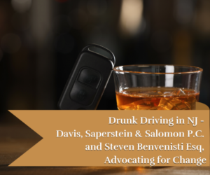 car keys and a glass of alcoholic drink on a wooden table - concept of drunk driving
