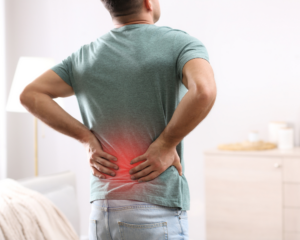 man suffering from back pain after a car accident