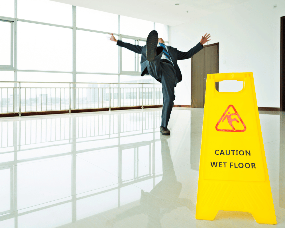 person slipping on the floor and is about to fall